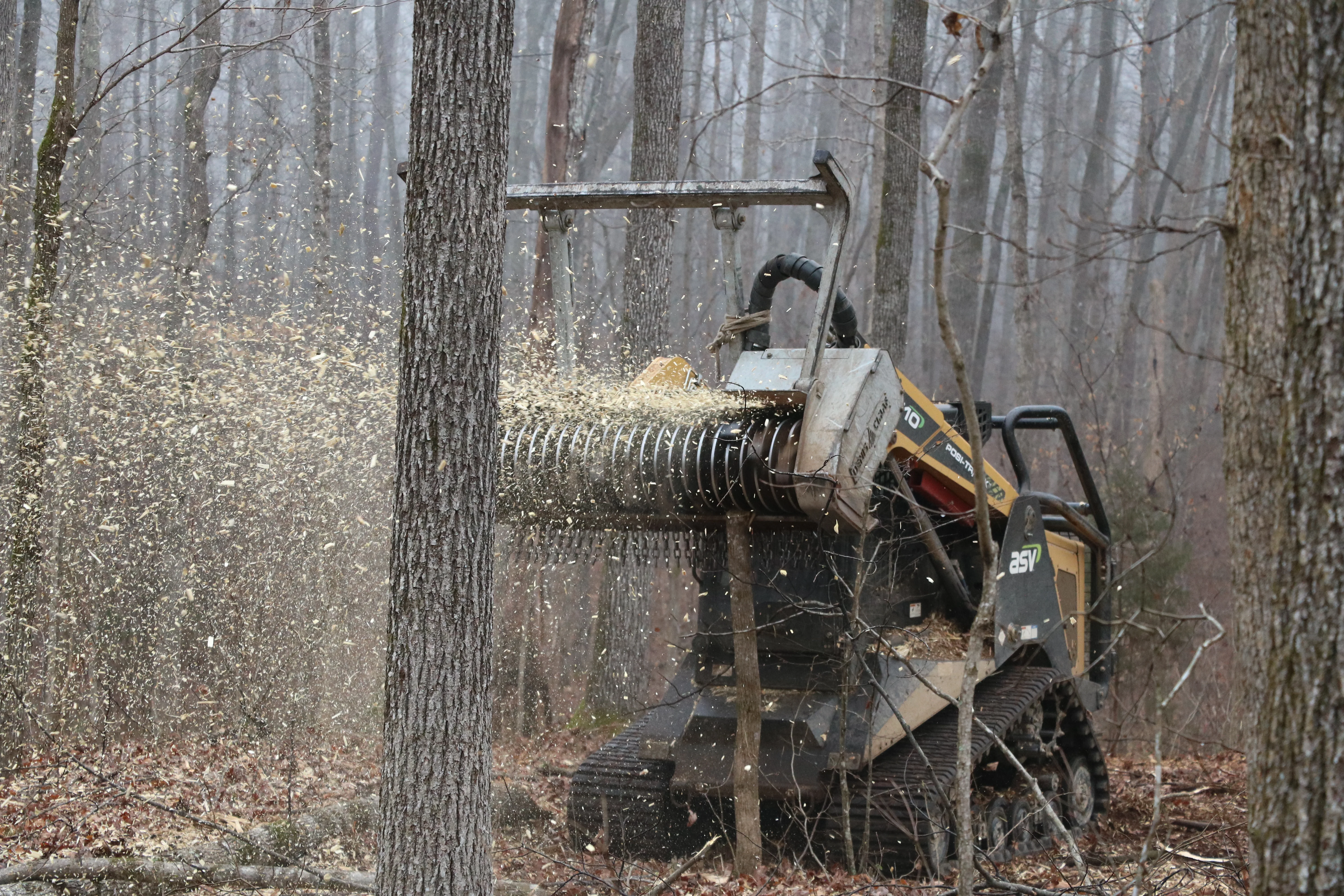 Vegetation management and brush clearing services in Placer County - compact track loader with forestry mulcher in Roseville California