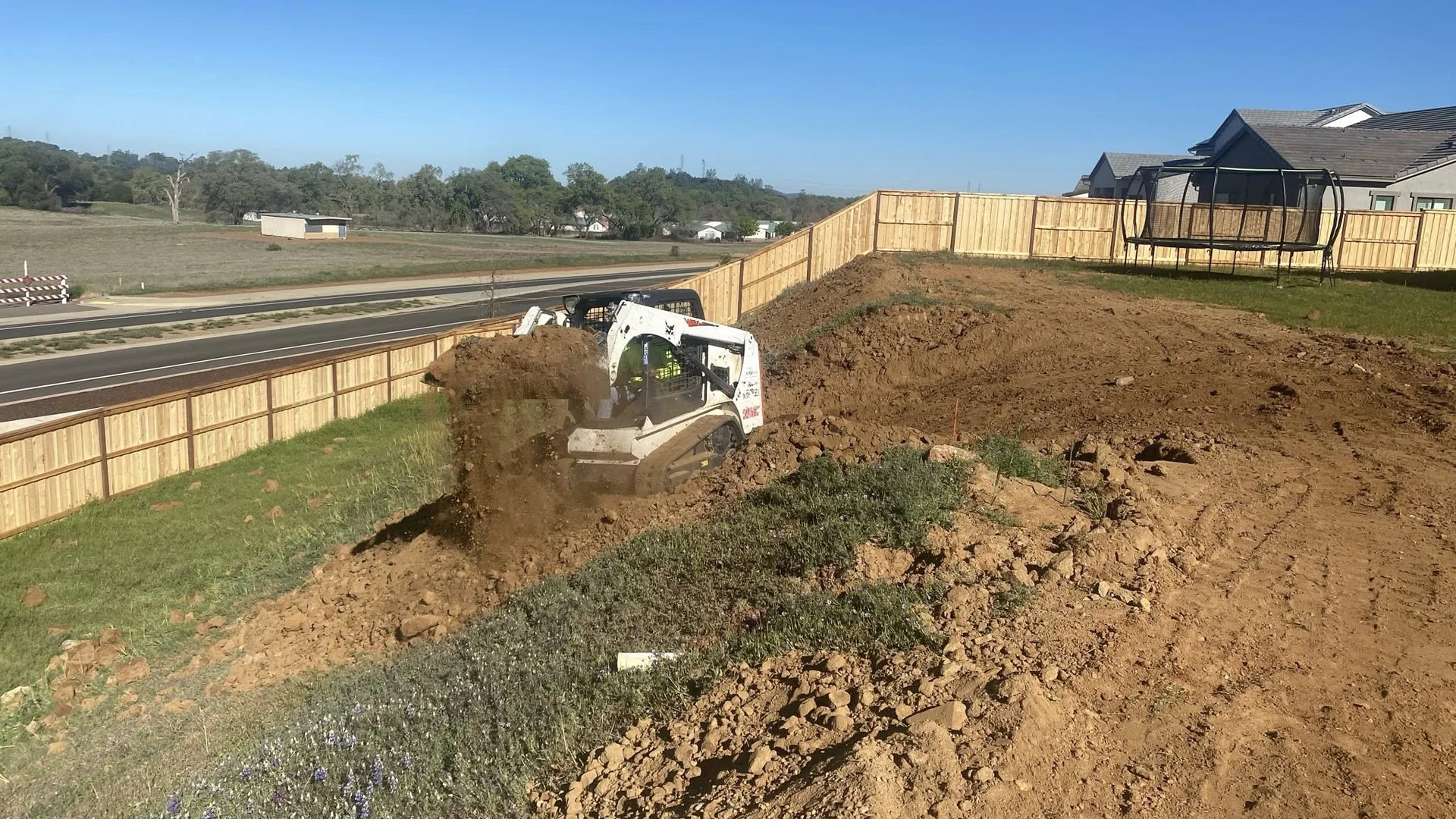 Residential excavation and dirt removal project in El Dorado County with professional grading equipment