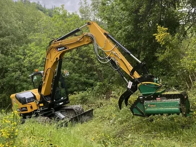 Professional excavator performing brush clearing for vegetation management in Northern California